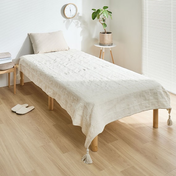 厚くボリューム感のある ニット調スローケット(ソフィマ 140x200 アイボリー) 1枚目画像