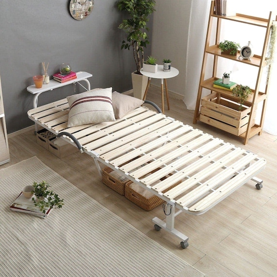 棚・コンセント・キャスター付き 折りたたみスノコベッド(WH) 1枚目画像